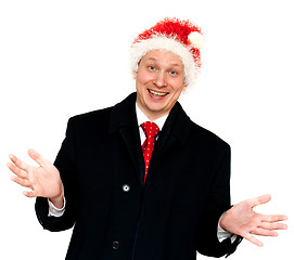 Image showing Man in suit and red tie in hat santa