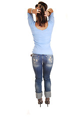 Image showing Young woman standing from back.