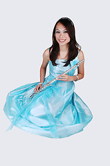 Image showing Chinese girl in dress with flute.