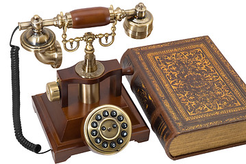 Image showing Ancient phone and book