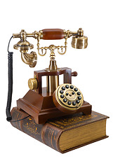 Image showing Ancient phone and book