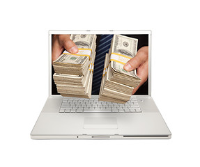 Image showing Man Handing Stacks of Money Through Laptop Screen