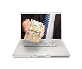 Image showing Businessman Handing Stack of Money Through Laptop Screen