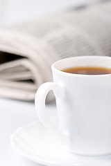 Image showing cup of coffee and newspapers