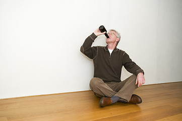 Image showing Taking A Beer In An Empty Room