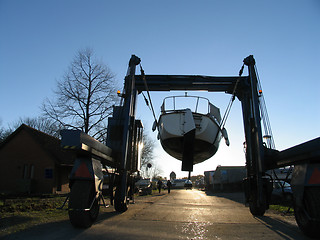 Image showing Boat on crane