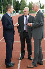 Image showing Discussing On A Racetrack -2