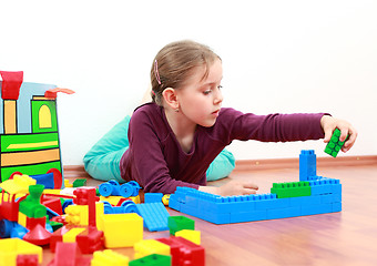 Image showing Adorable girl playing with blocks