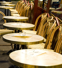 Image showing night scene Paris France cafe setting tables chairs