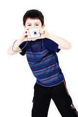 Image showing Young boy with digital camera prepare for shooting