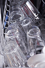 Image showing Detail of dishwasher with open hatch and clean glasses