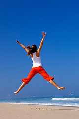 Image showing Young woman jumping