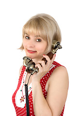 Image showing The beautiful woman with ancient phone