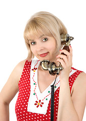 Image showing The beautiful woman with ancient phone