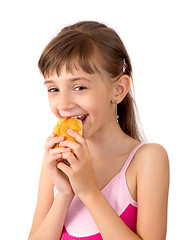 Image showing The girl eats a patty