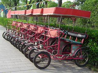 Image showing Line of Red Pedal Cars