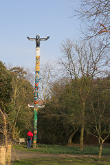 Image showing man looking at totem pole