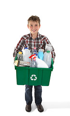 Image showing Boy holding recycling bin full or rubbish