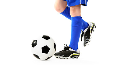 Image showing Boy kicking soccer ball