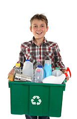 Image showing Happy boy carrying rubbish for recycling