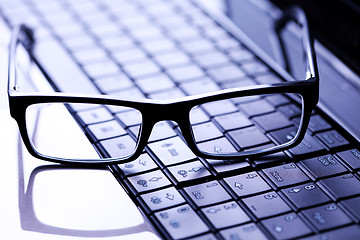 Image showing glasses on laptop