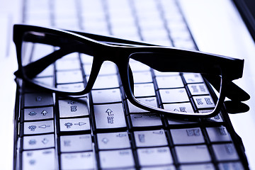 Image showing glasses on laptop