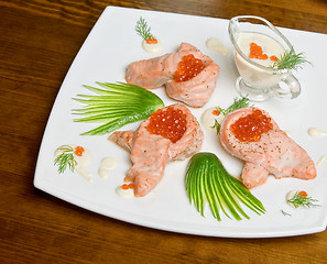 Image showing roasted salmon filet with red caviar