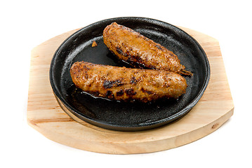 Image showing sausages at pan with sauce