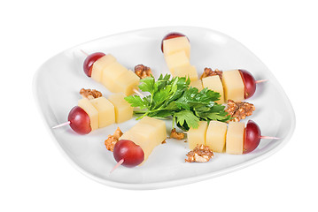 Image showing Cheese and grapes and nuts