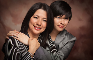 Image showing Attractive Multiethnic Mother and Daughter Studio Portrait