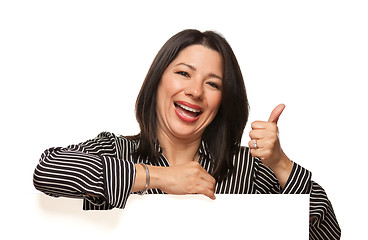 Image showing Multiethnic Woman Leaning on Blank White Sign with Thumbs Up