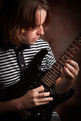 Image showing Young Musician Plays His Electric Guitar