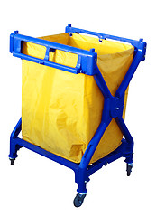 Image showing Blue Plastic Trolley with Large Yellow Rubbish Bag