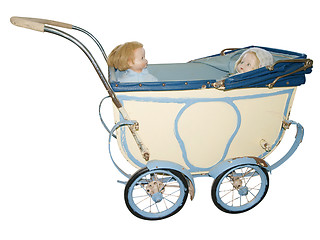 Image showing Two Dolls in an Antique Pram