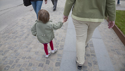 Image showing Mother walking with girl