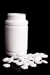 Image showing bottle with white pills