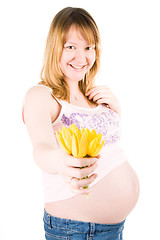 Image showing pregnant woman with yellow tulips 