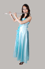 Image showing Chinese girl in dress with flute.