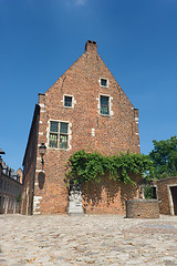 Image showing Medieval house w water pump