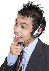 Image showing Listening Asian telemarketer