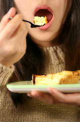 Image showing Eating cheese cake