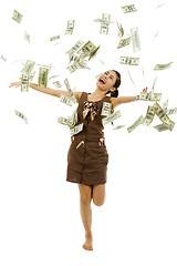 Image showing pretty woman throwing money