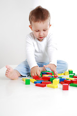 Image showing Lovely boy playing with blocks