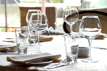 Image showing Glasses served on table in restaurant