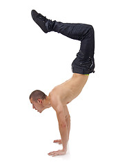 Image showing Young bboy standing on hands