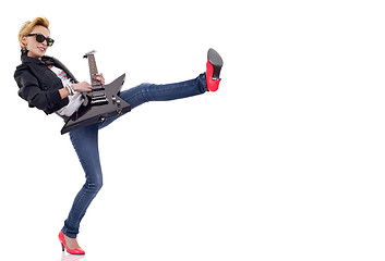 Image showing kicking woman guitarist
