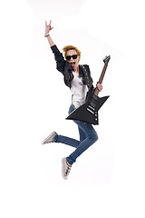 Image showing woman guitarist jumps