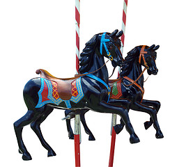 Image showing Two Black Merry-Go-Round Horses 