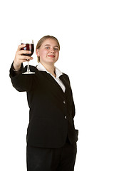 Image showing young business woman toasting with glass of wine 