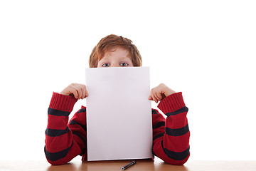 Image showing kid holding a white sheet of paper in his hand